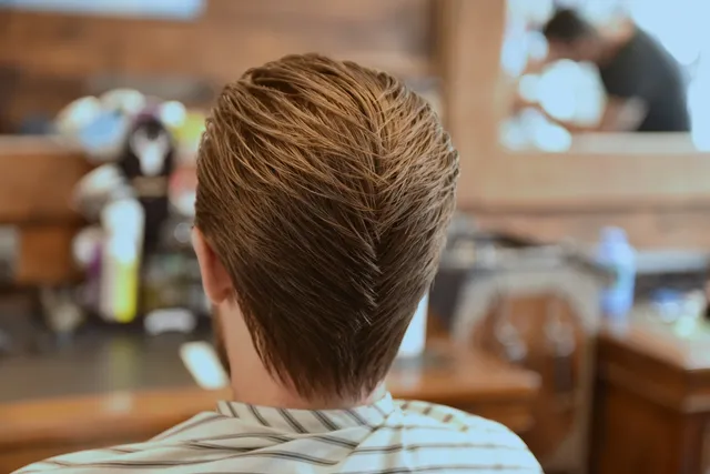 A close, textured fade finished at Dapper Chaps